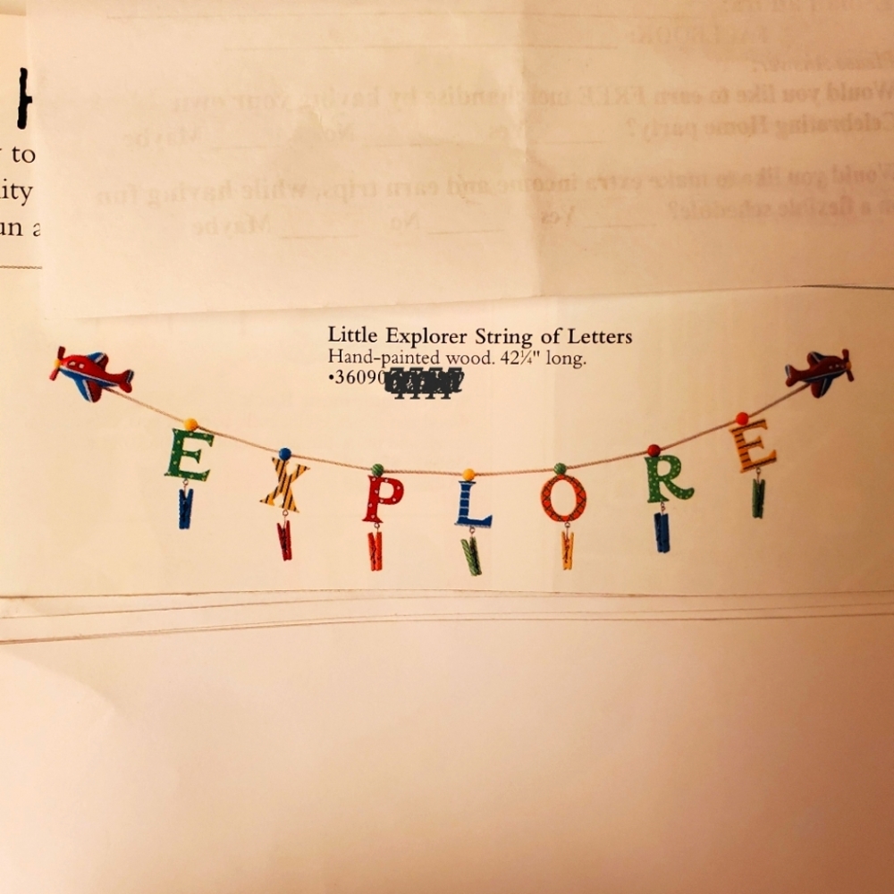 Explore, wooden painted letters has mini clothespins to hang memories New